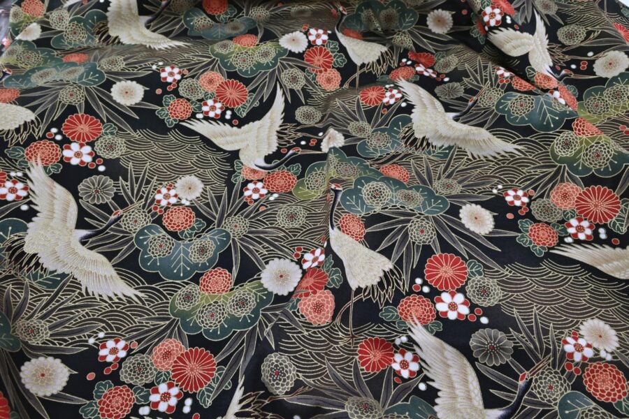 Japanese fabric cranes on golden river