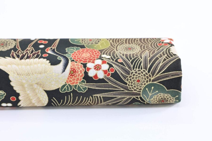 Japanese fabric cranes on golden river