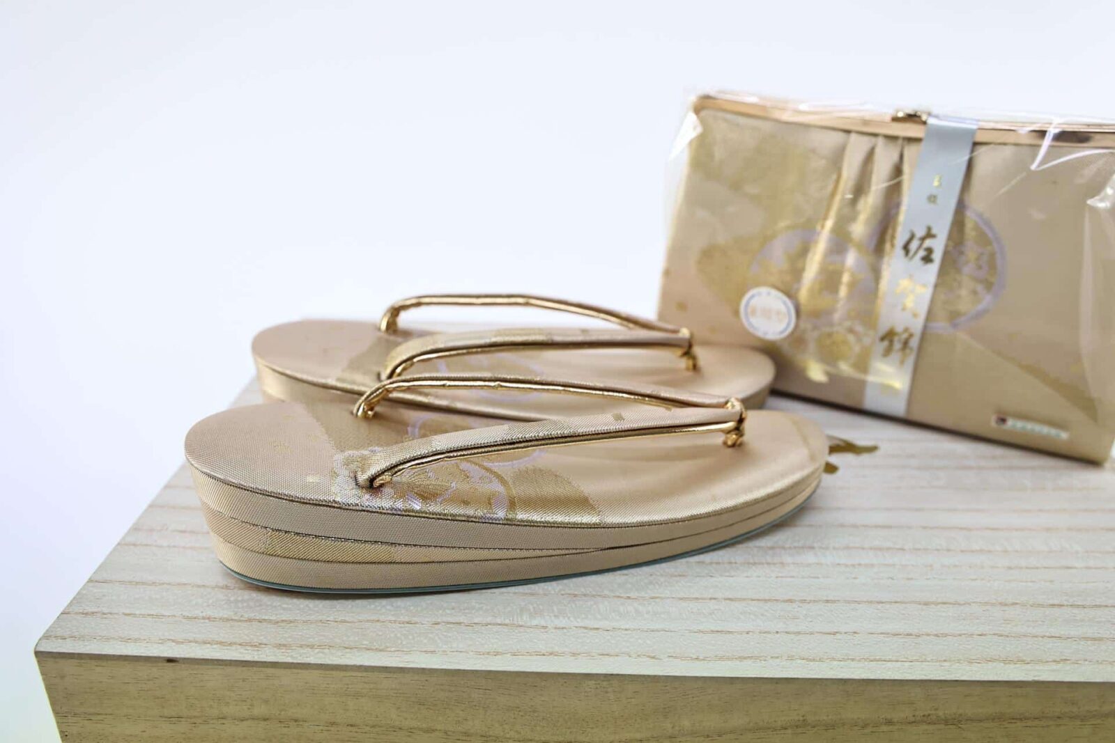 Gold Zori and clutch with their box