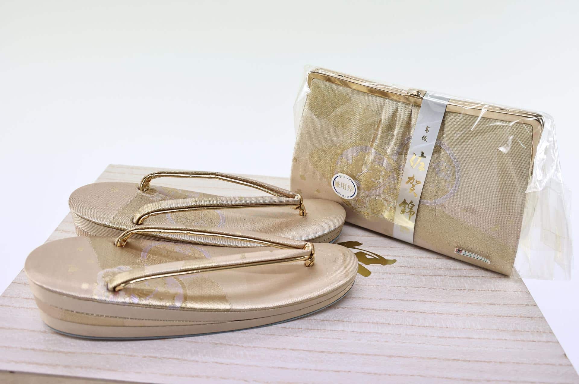 Gold Zori and clutch with their box