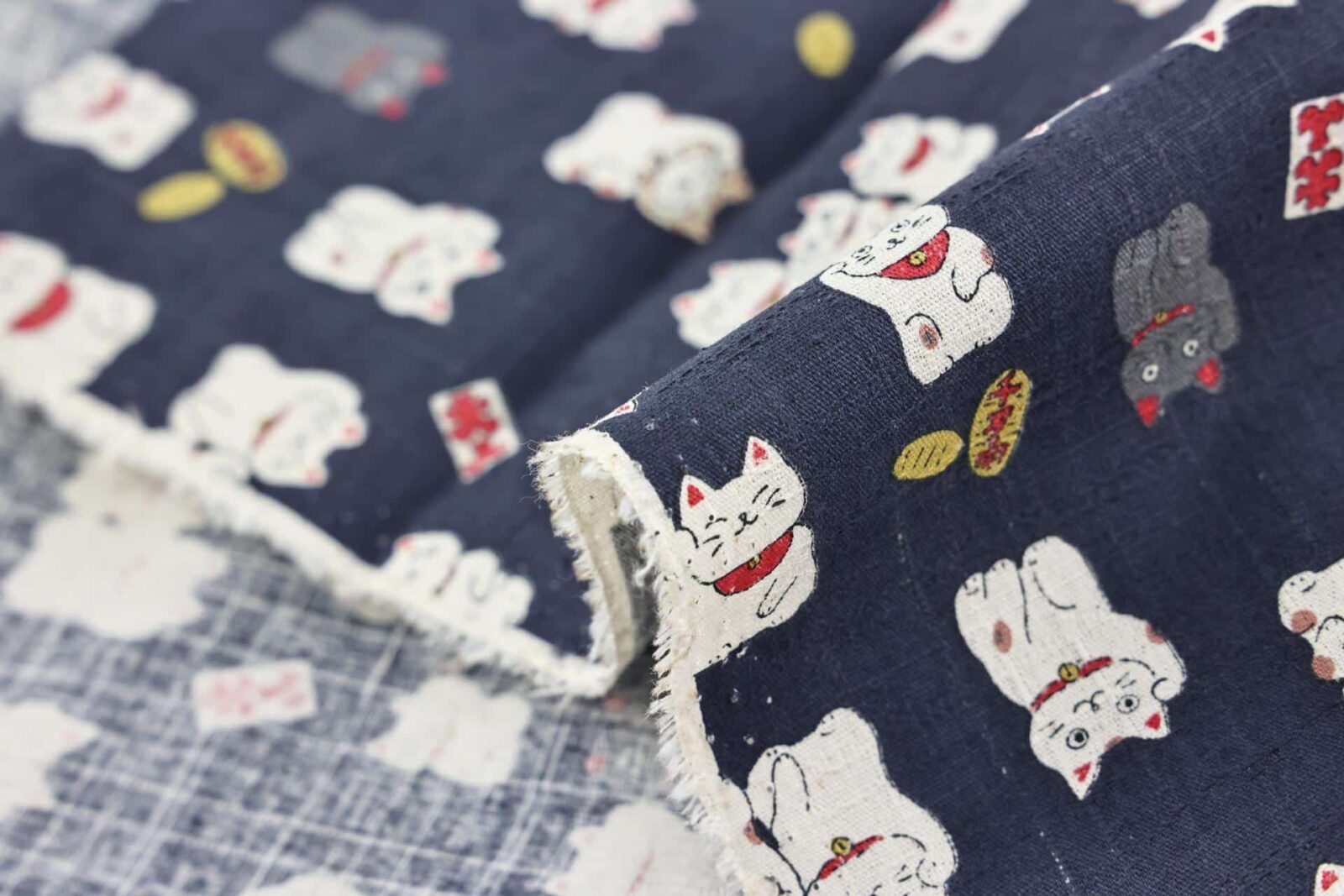 Japanese Maneki Neko dobby cotton fabric – blue background