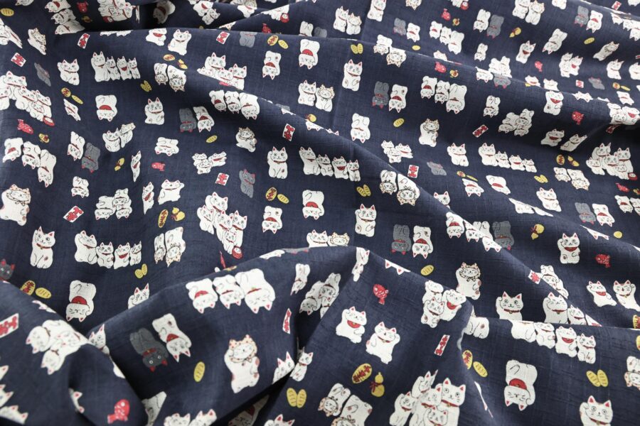 Japanese Maneki Neko dobby cotton fabric – blue background