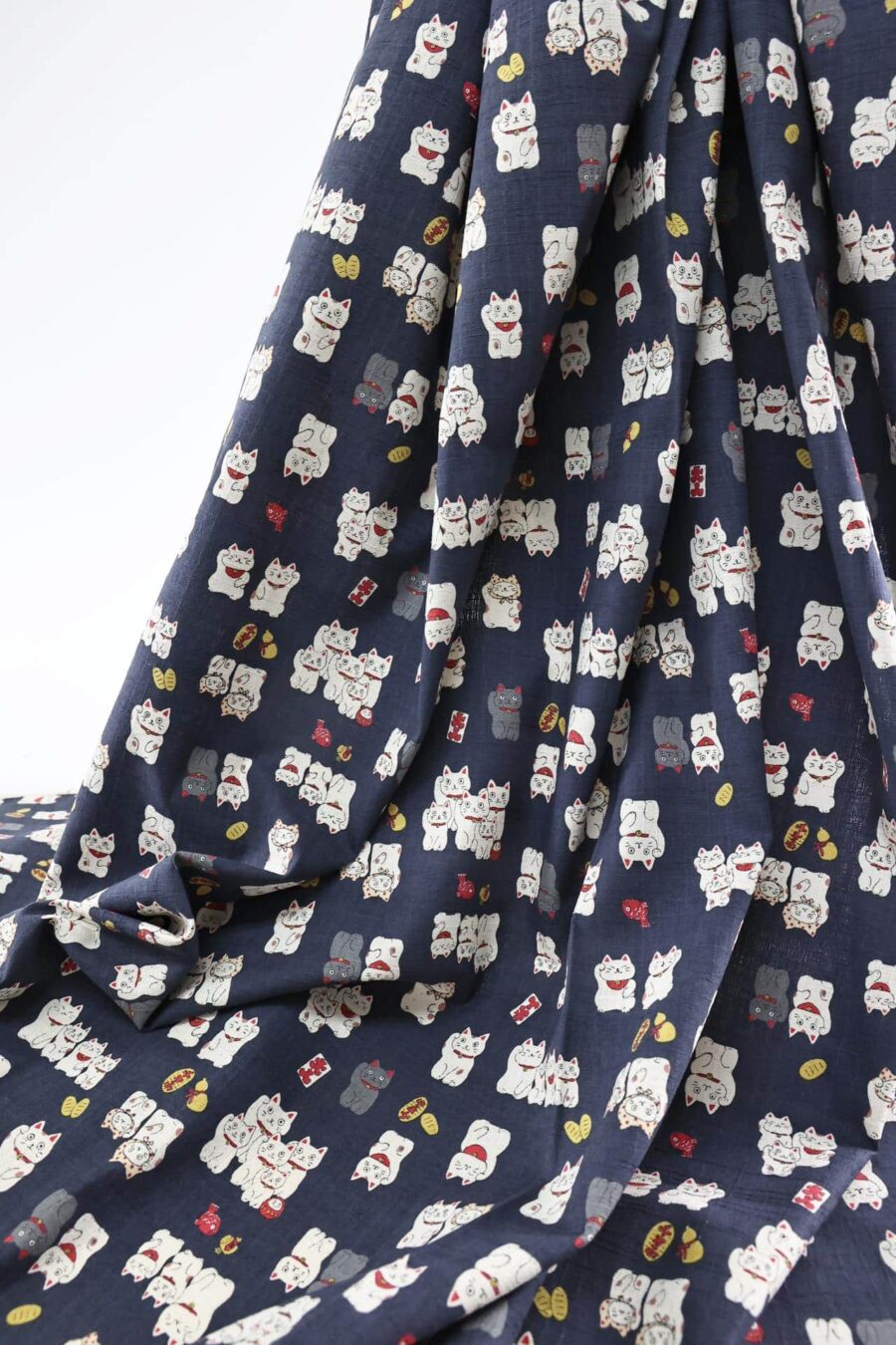 Japanese Maneki Neko dobby cotton fabric – blue background