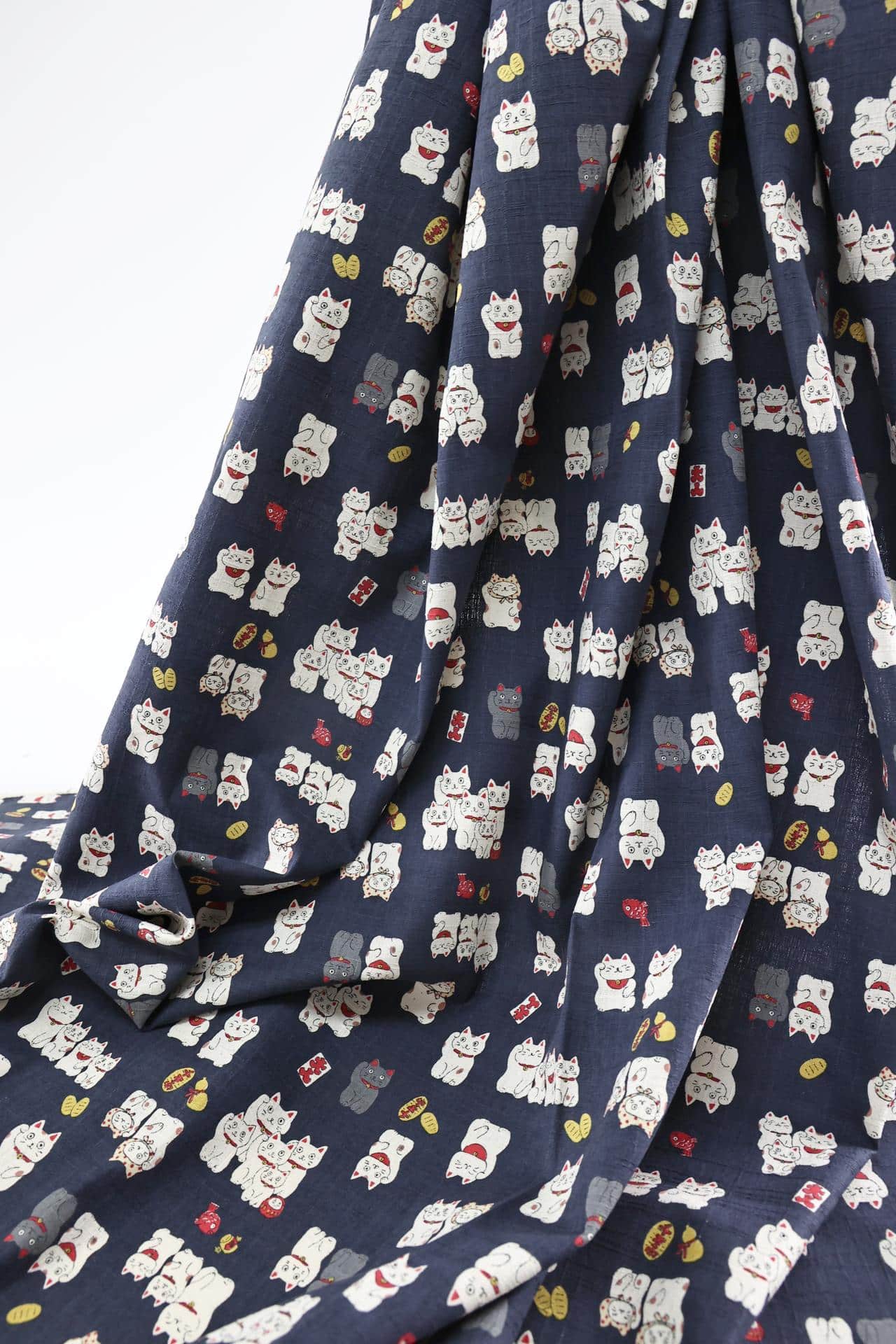 Japanese Maneki Neko dobby cotton fabric – blue background