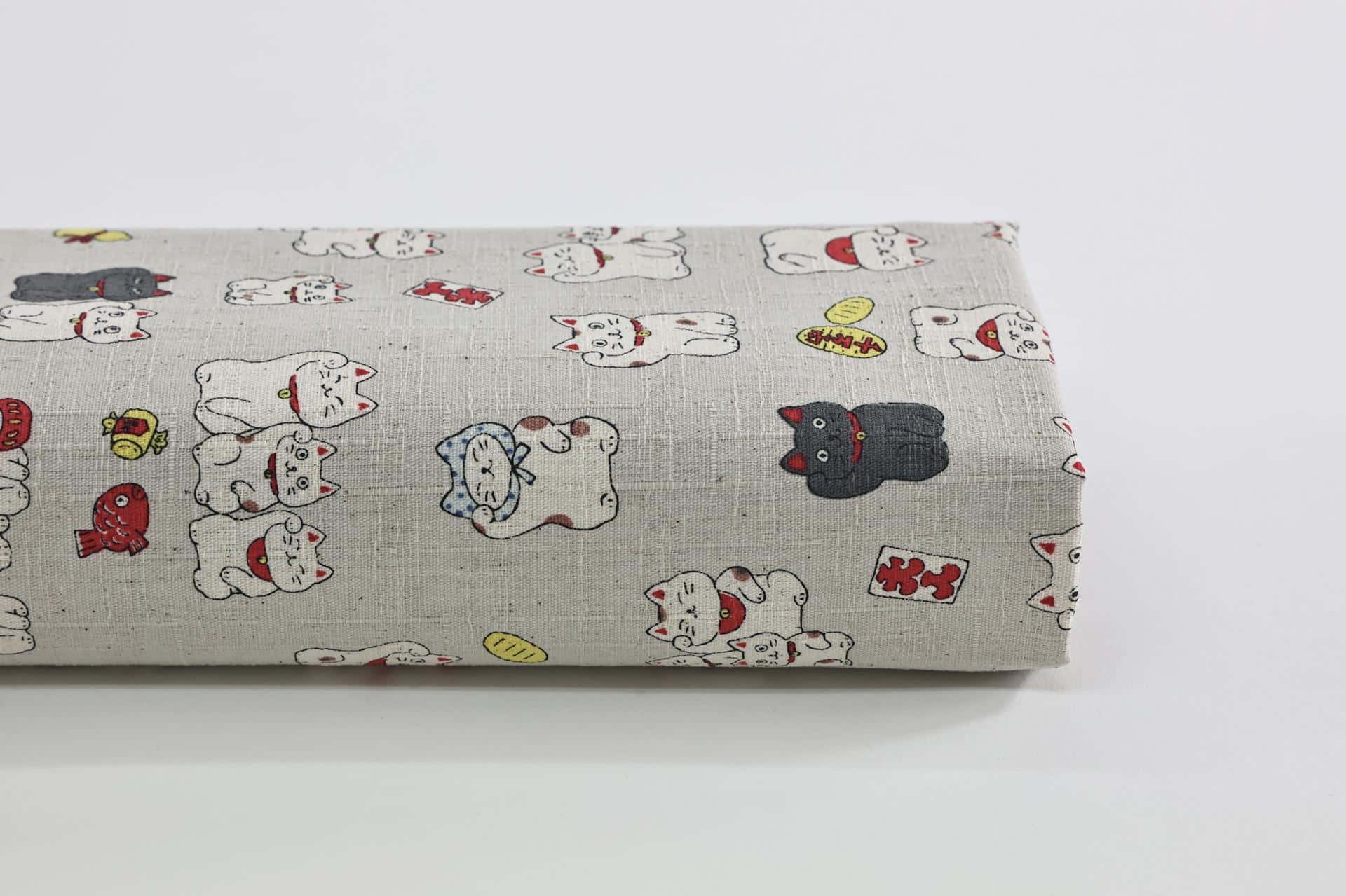 Japanese Maneki Neko dobby cotton fabric – ecru background
