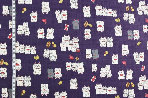 Japanese Maneki Neko dobby cotton fabric – purple background