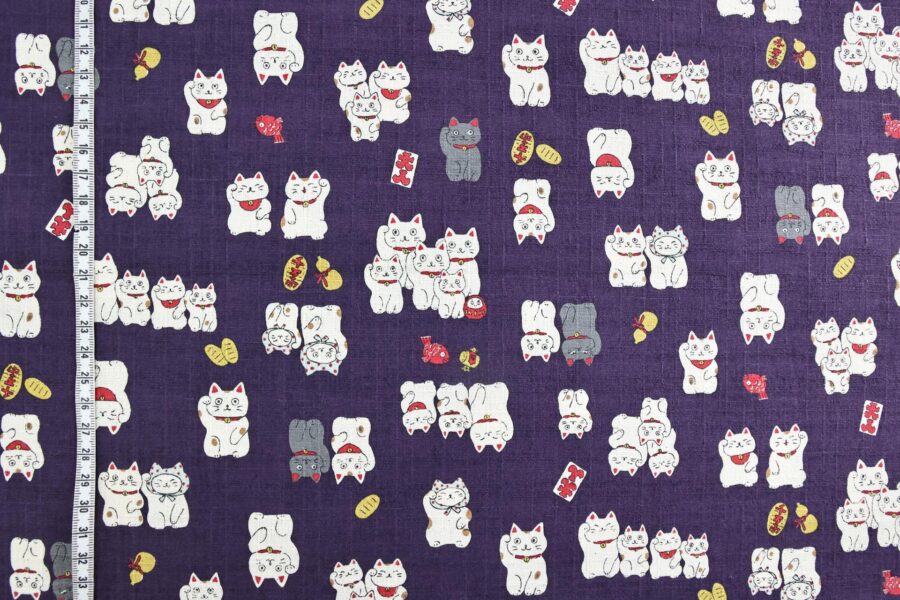 Japanese Maneki Neko dobby cotton fabric – purple background