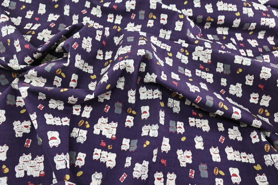 Japanese Maneki Neko dobby cotton fabric – purple background