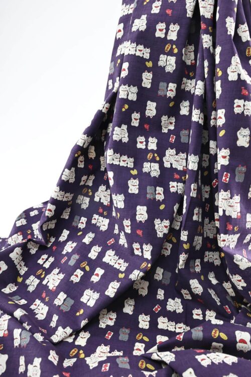 Japanese Maneki Neko dobby cotton fabric – purple background
