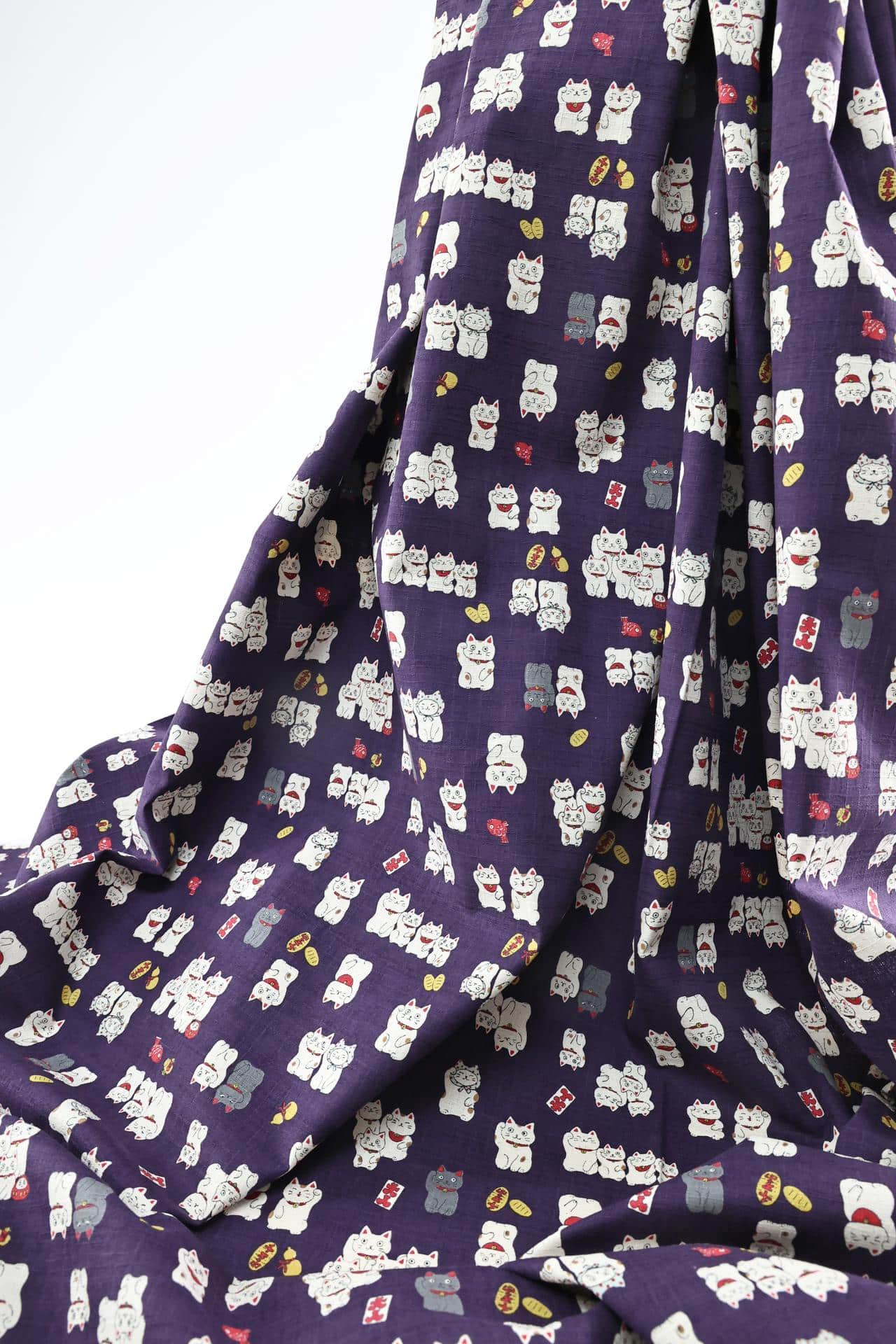 Japanese Maneki Neko dobby cotton fabric – purple background