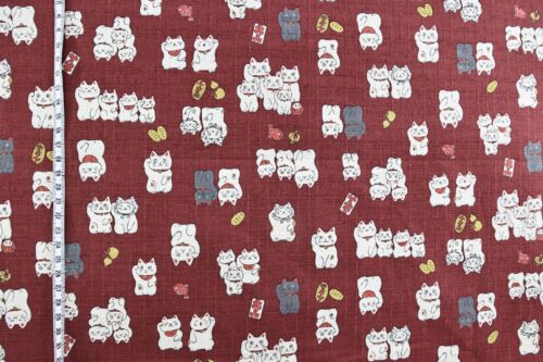 Japanese Maneki Neko dobby cotton fabric – red background