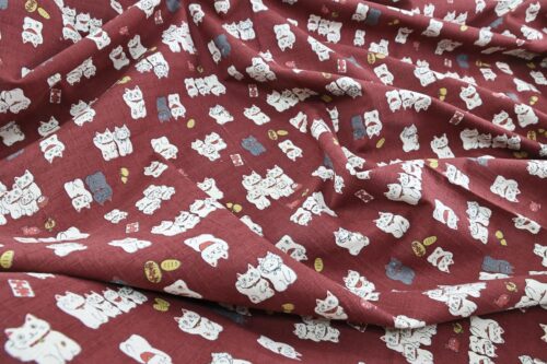 Japanese Maneki Neko dobby cotton fabric – red background