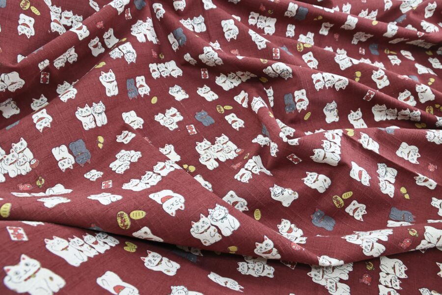 Japanese Maneki Neko dobby cotton fabric – red background
