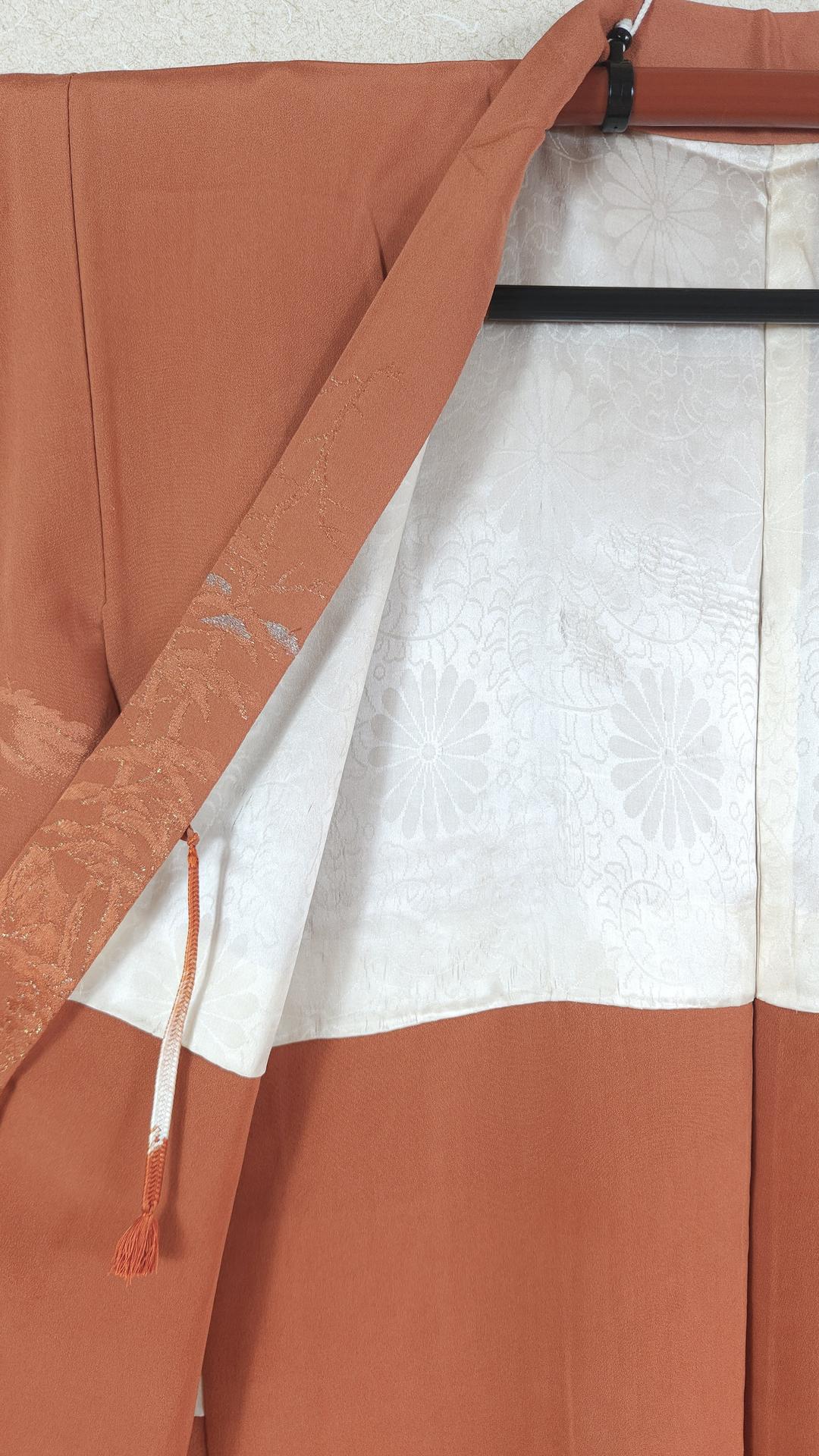 Orange Haori with silver landscape motifs