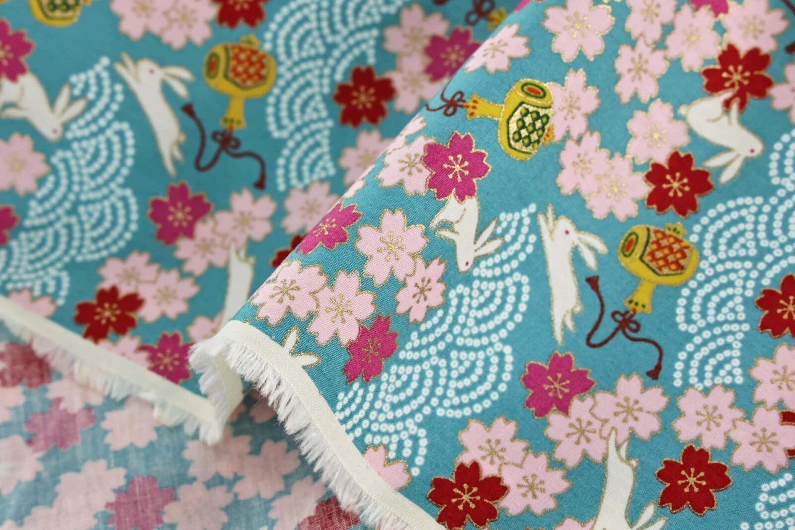 Japanese fabric Usagi and sakura turquoise background