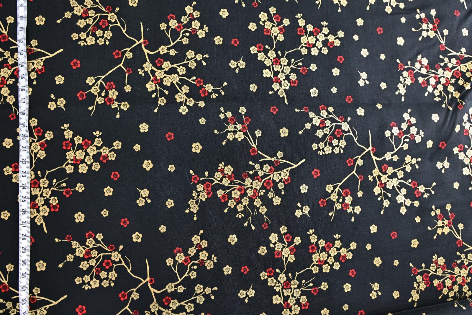 Japanese fabric golden plum blossoms black background