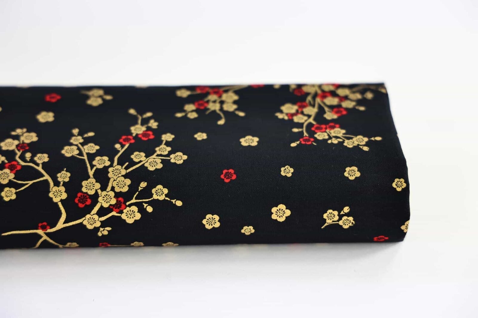 Japanese fabric golden plum blossoms black background