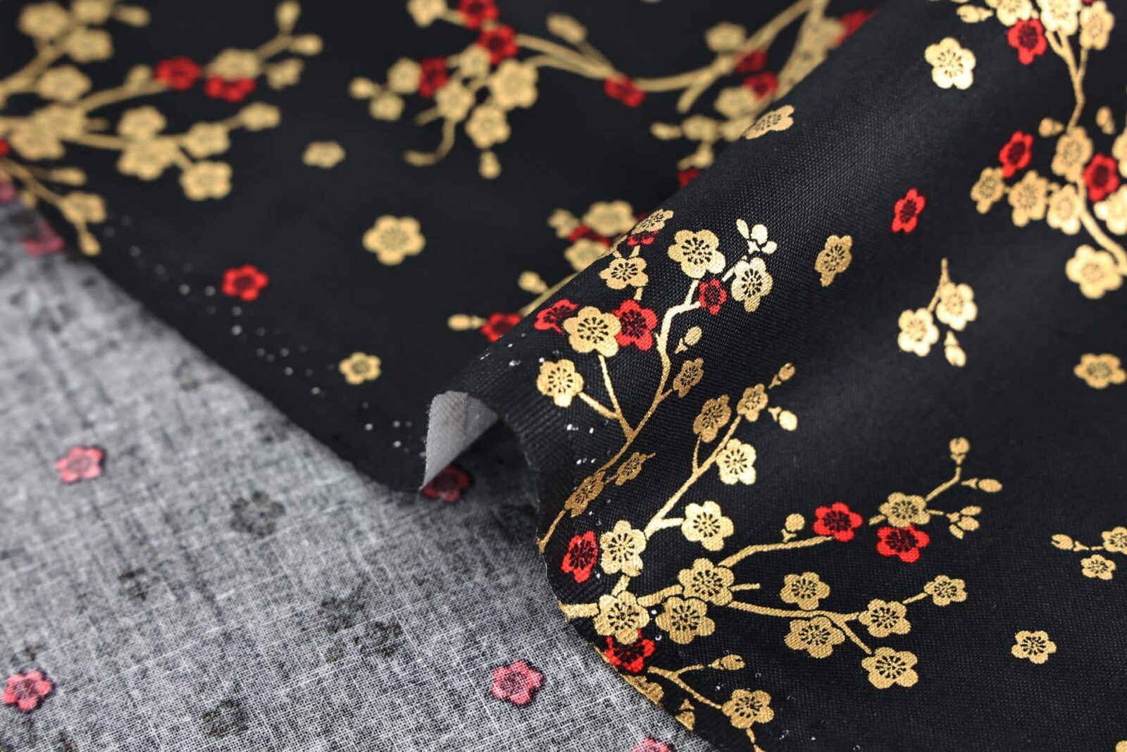 Japanese fabric golden plum blossoms black background