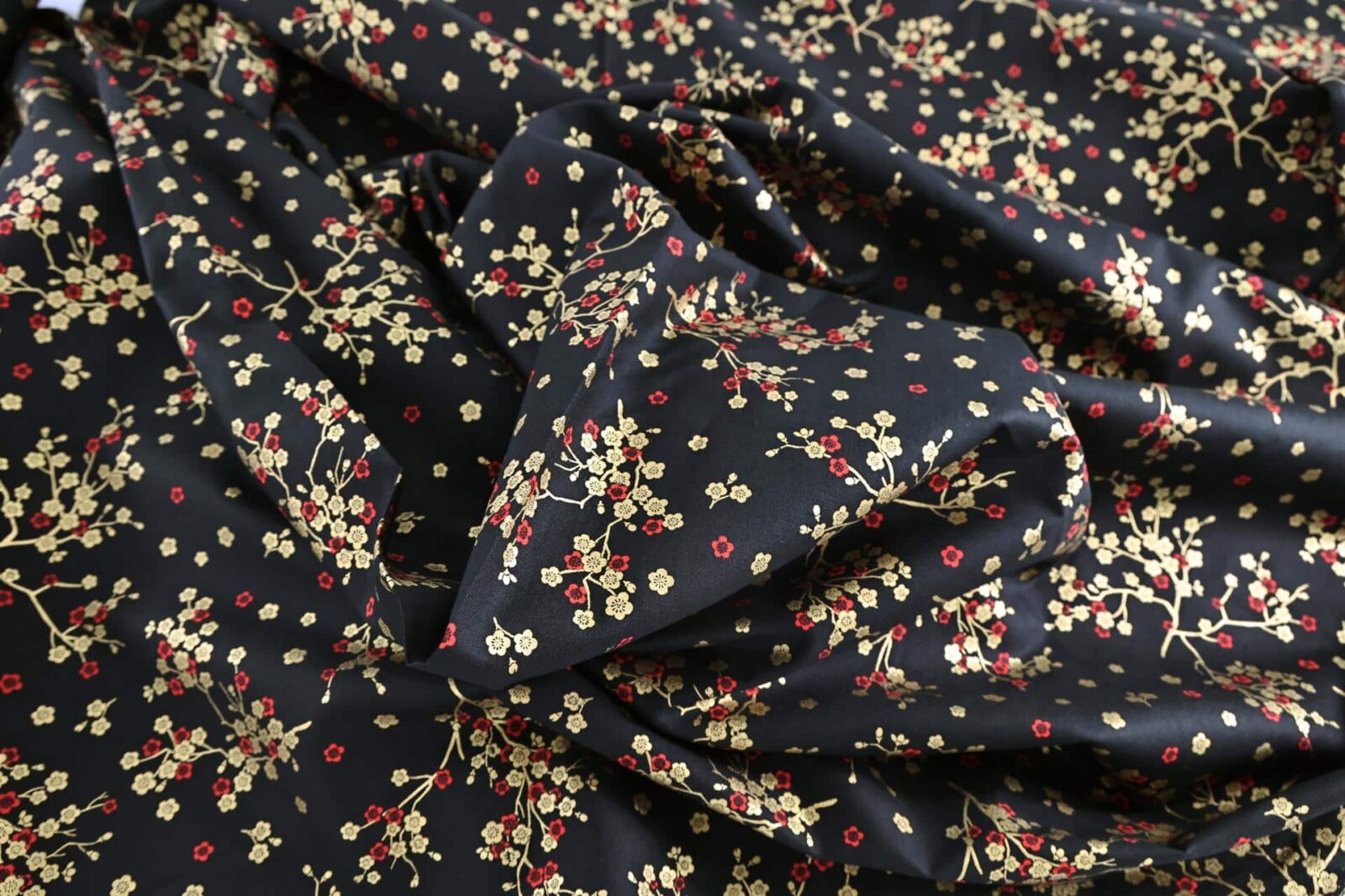Japanese fabric golden plum blossoms black background