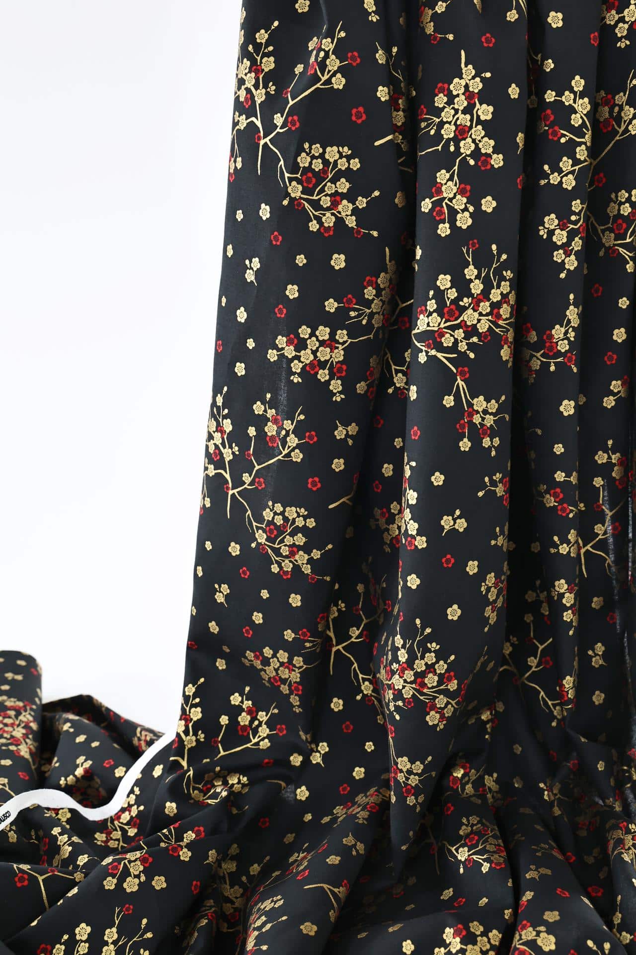 Japanese fabric golden plum blossoms black background