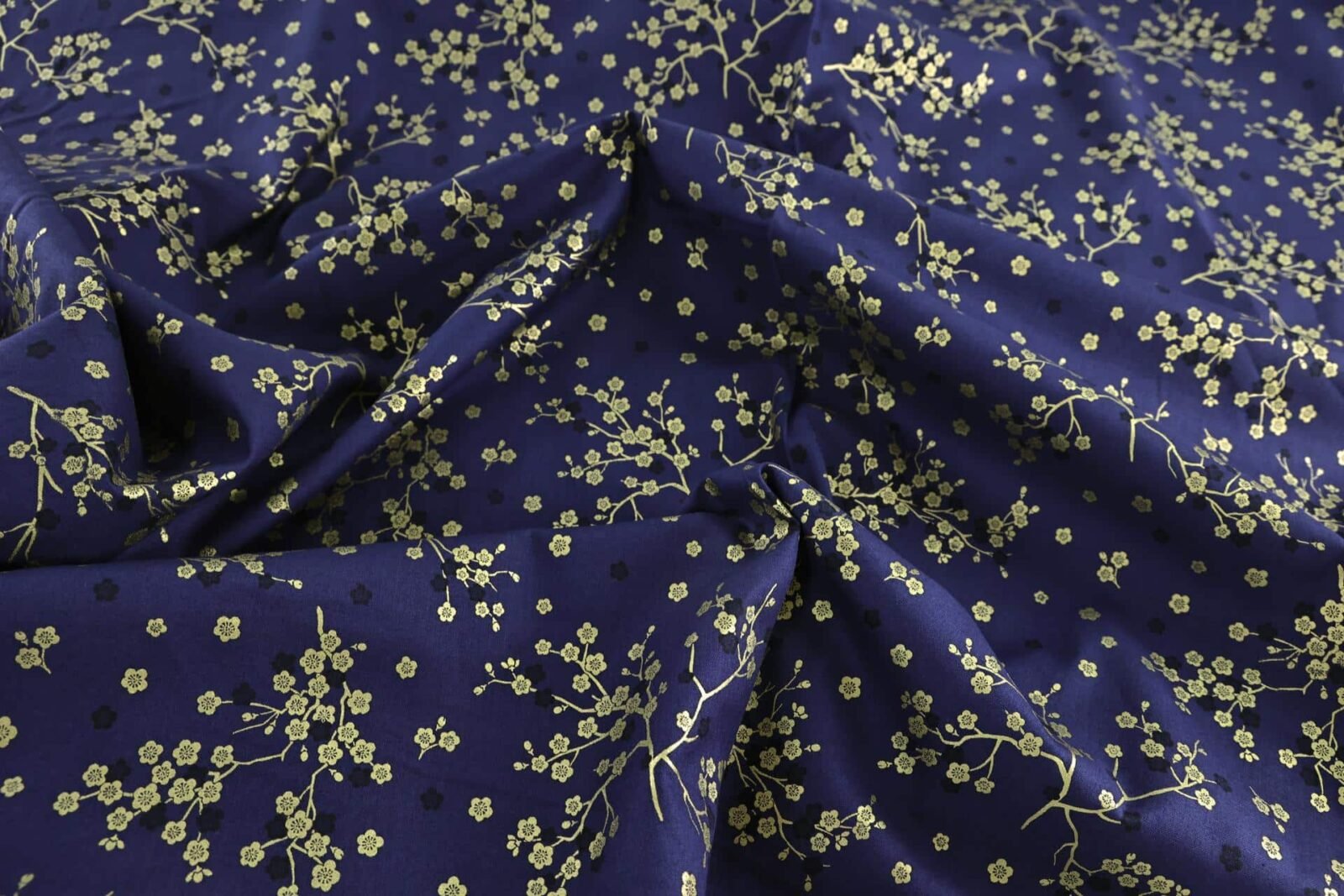 Japanese fabric golden plum blossoms blue background