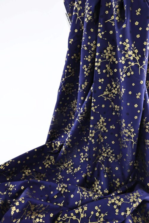 Japanese fabric golden plum blossoms blue background