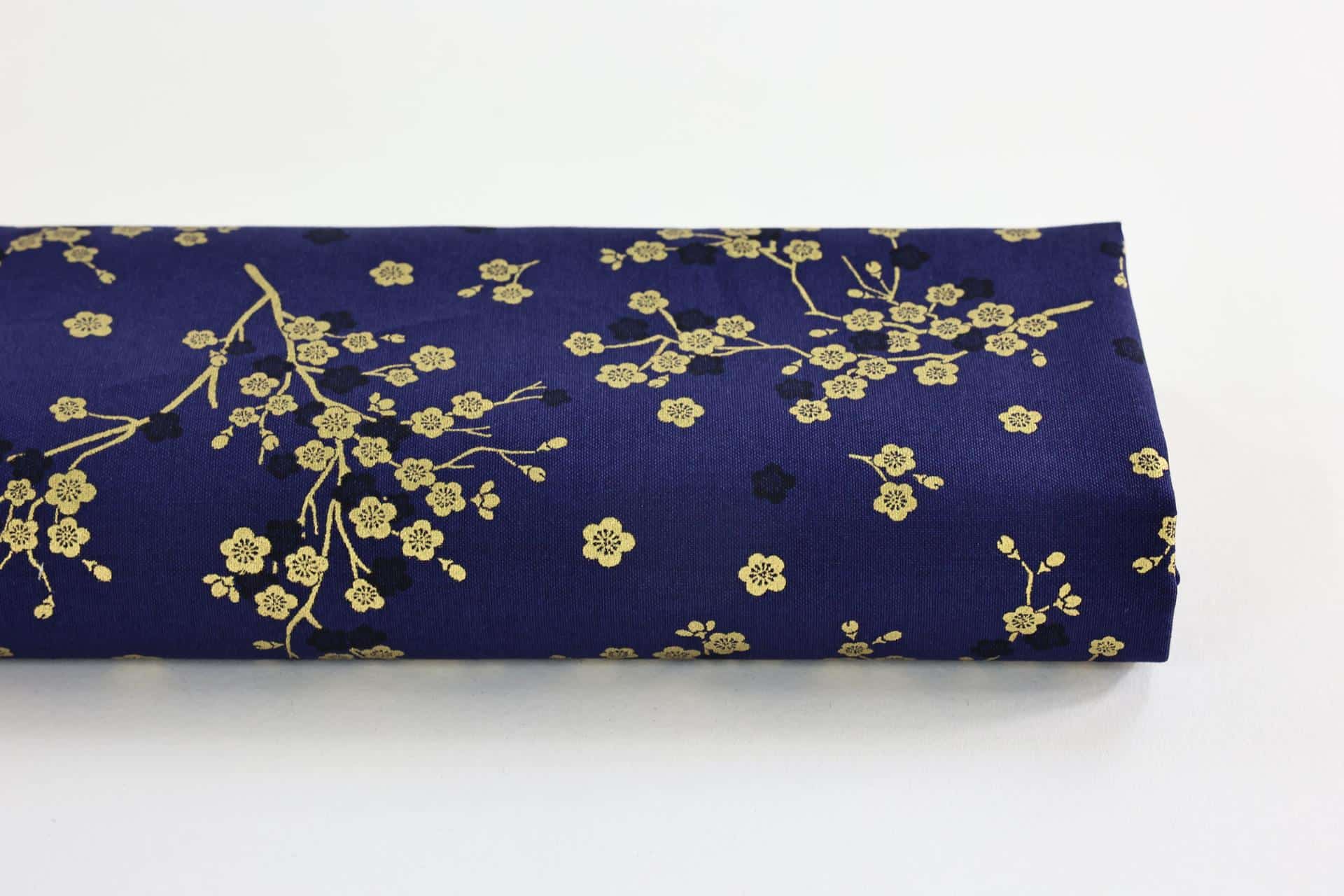 Japanese fabric golden plum blossoms blue background
