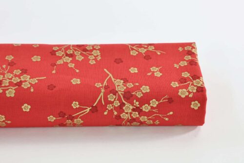 Japanese fabric golden plum blossoms red background
