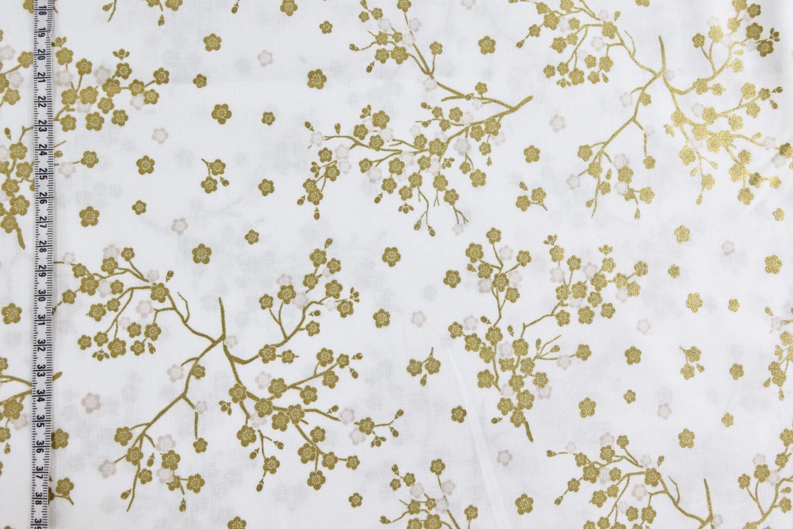 Japanese fabric golden plum blossoms white background