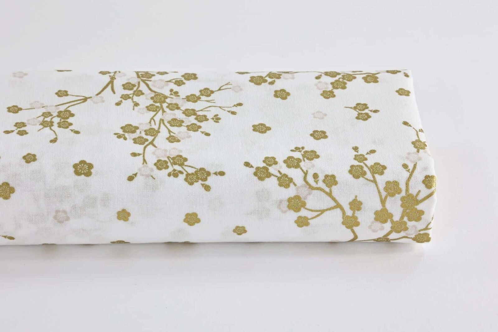 Japanese fabric golden plum blossoms white background