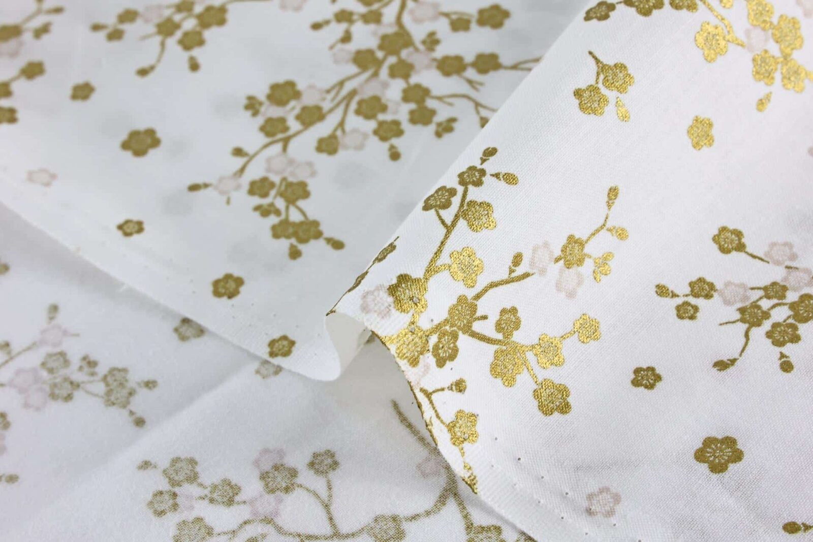 Japanese fabric golden plum blossoms white background