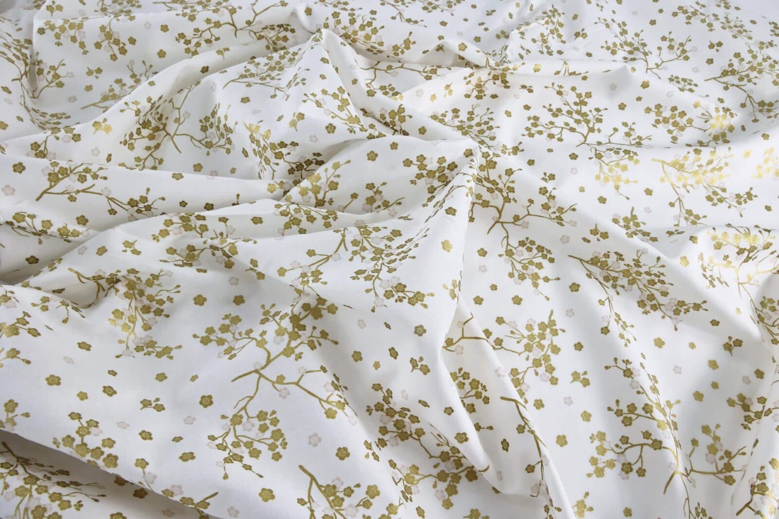 Japanese fabric golden plum blossoms white background
