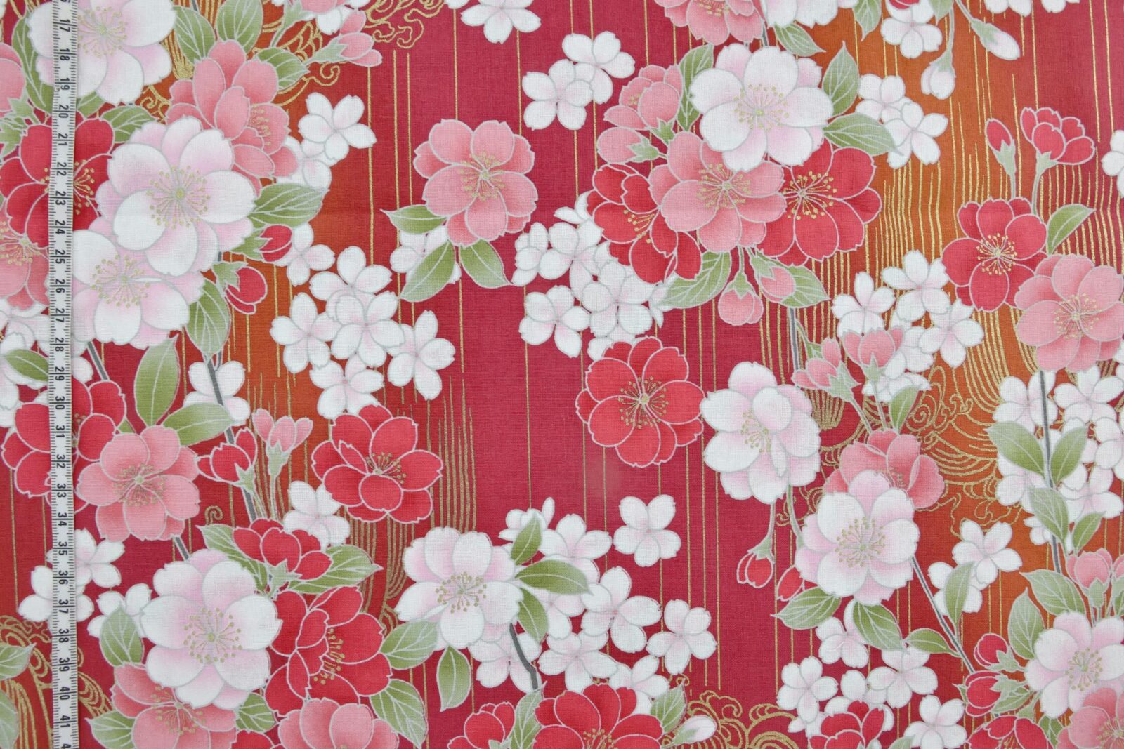 Japanese fabric golden sakura bouquets red background