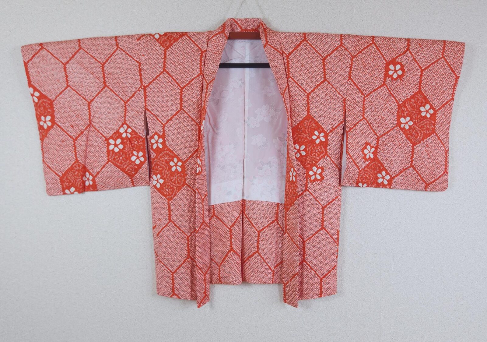 Orange-red Haori with Shibori Kikkō patterns