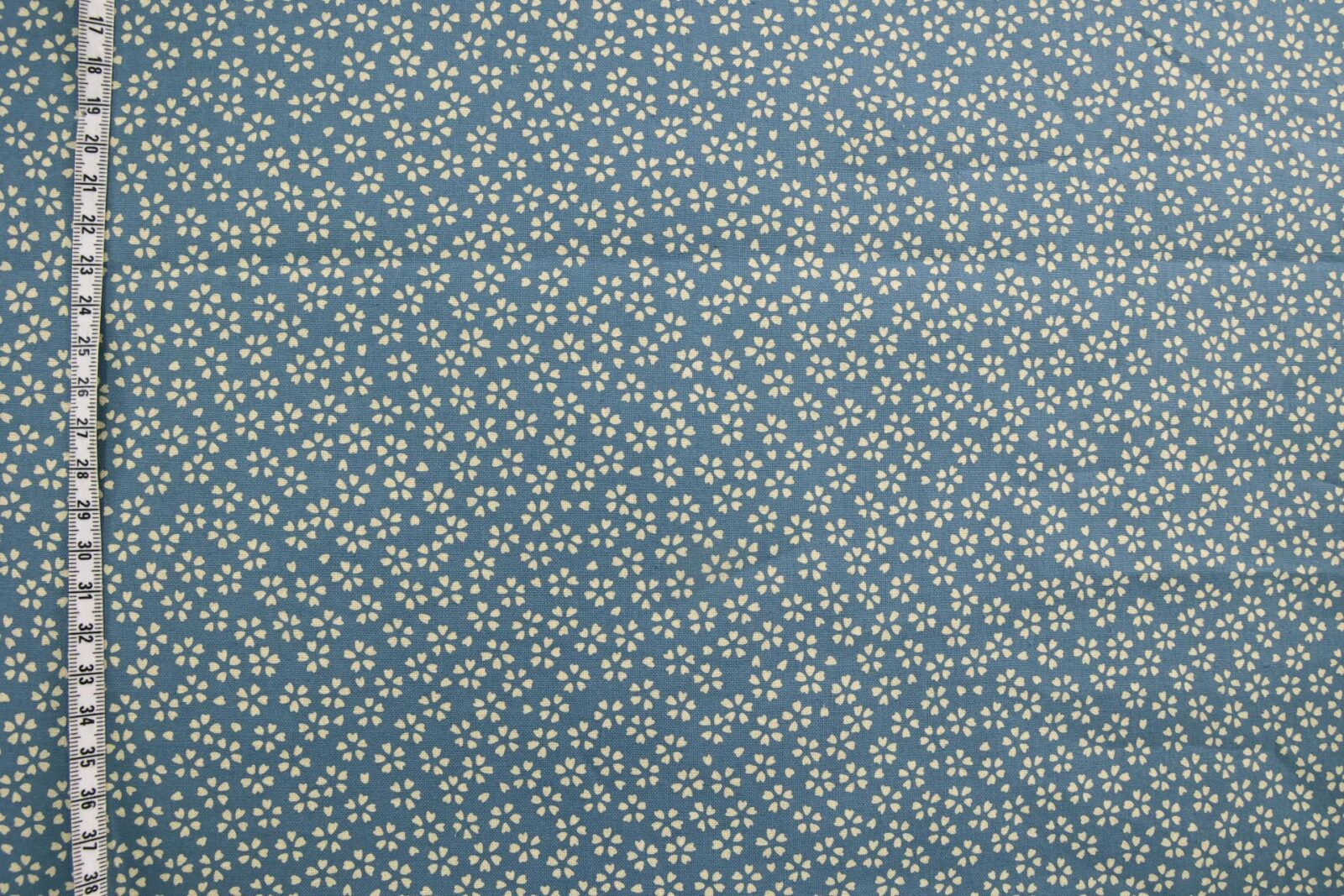 Sevenberry fabric ecru Sakura blue background