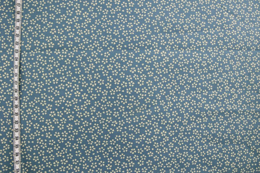 Sevenberry fabric ecru Sakura blue background