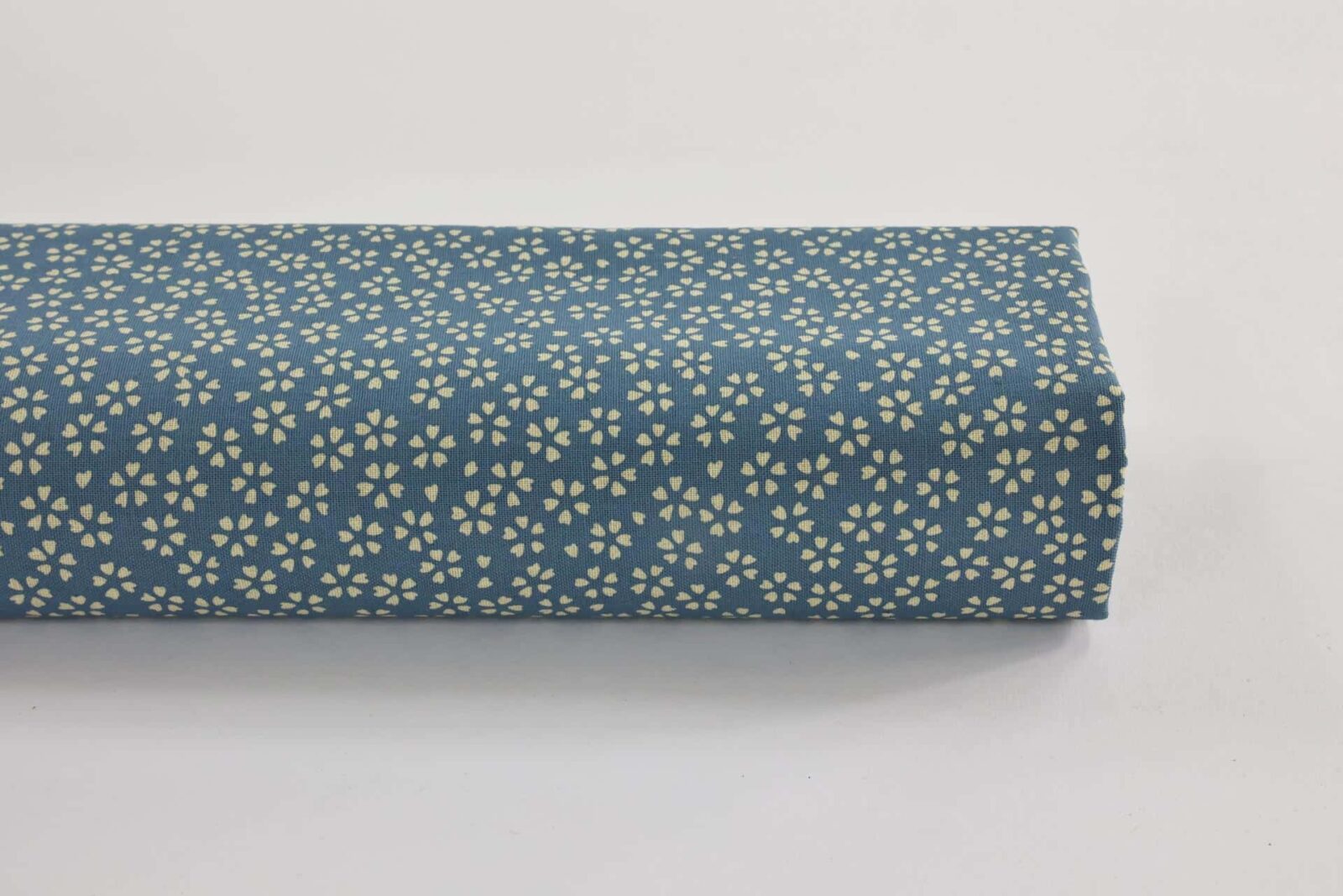 Sevenberry fabric ecru Sakura blue background