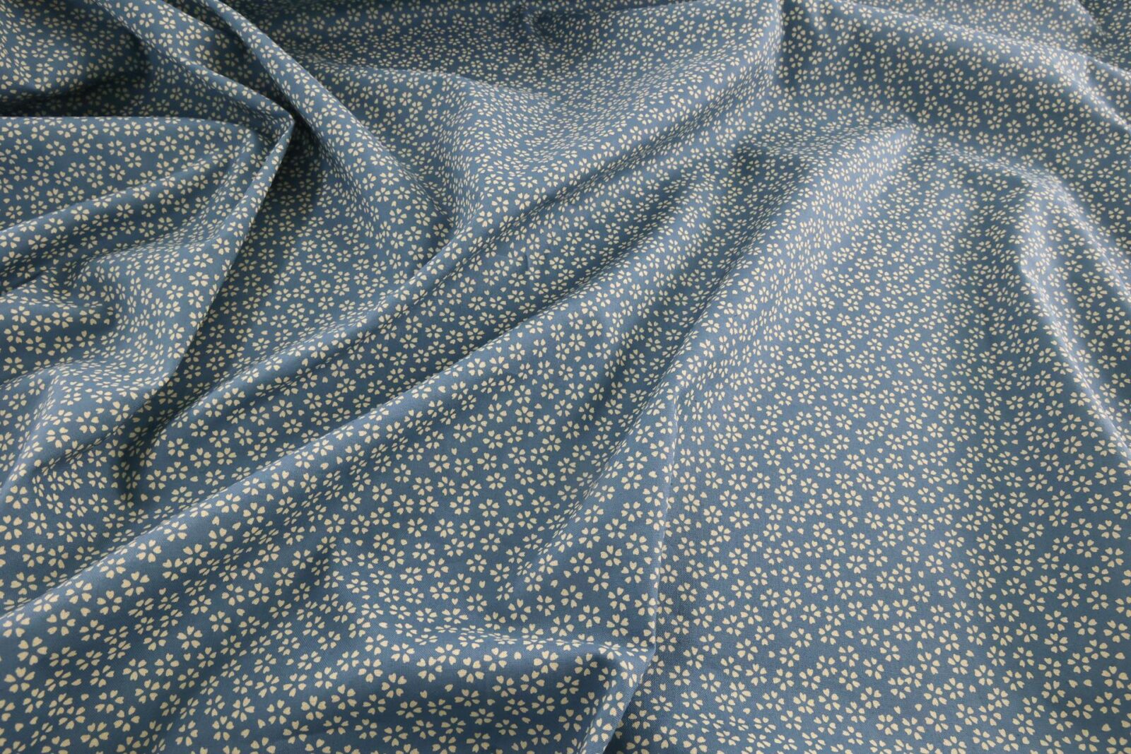 Sevenberry fabric ecru Sakura blue background