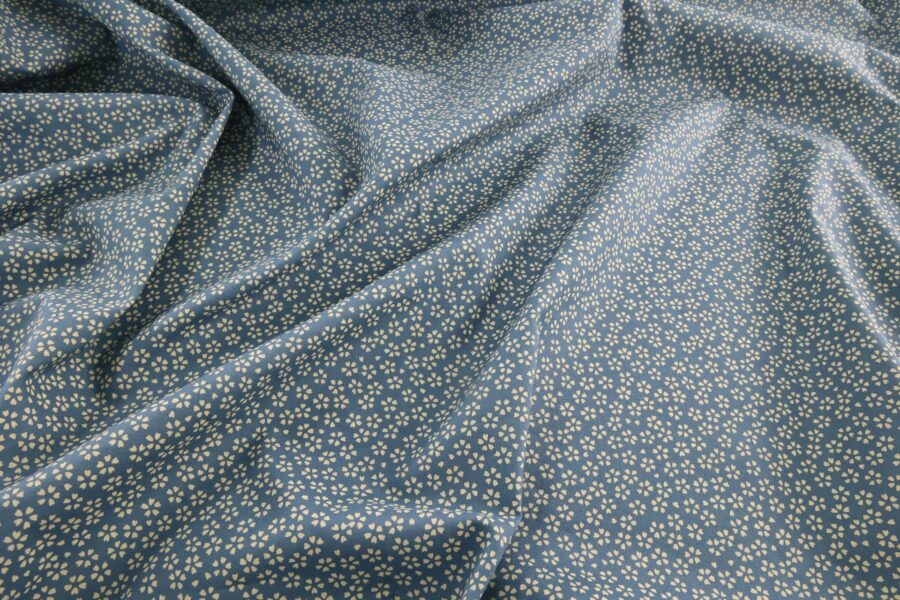 Sevenberry fabric ecru Sakura blue background