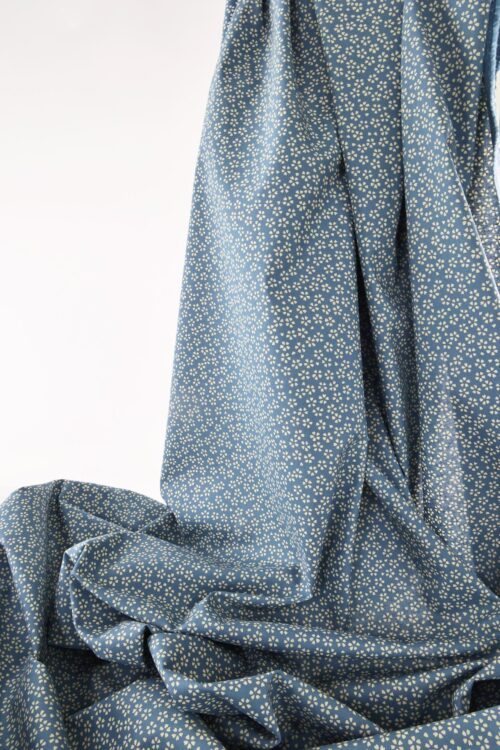 Sevenberry fabric ecru Sakura blue background