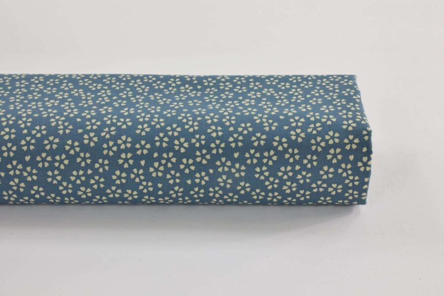 Sevenberry fabric ecru Sakura blue background