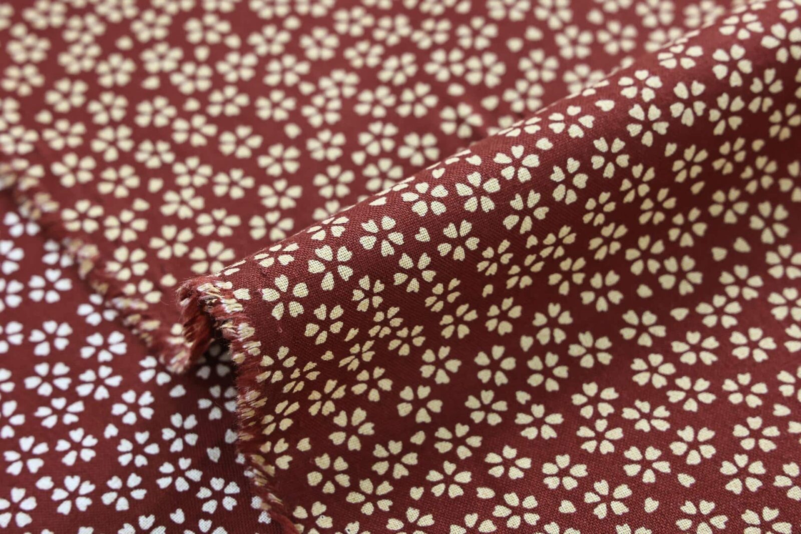 Sevenberry fabric ecru Sakura red background