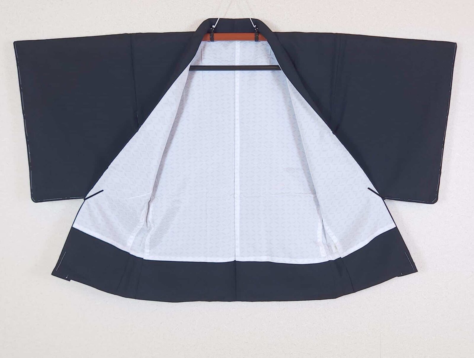 Black Haori with bright red-orange flowers