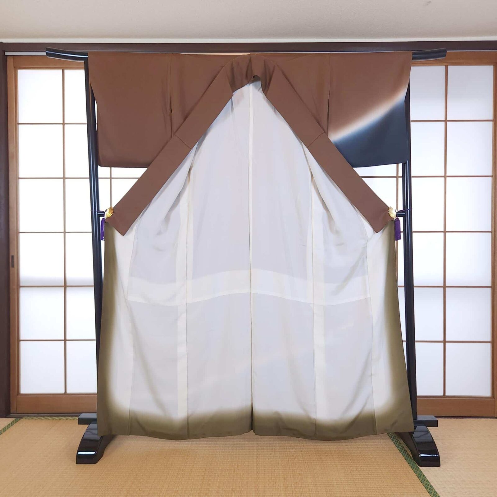 Brown Hōmongi with stylized animal motifs