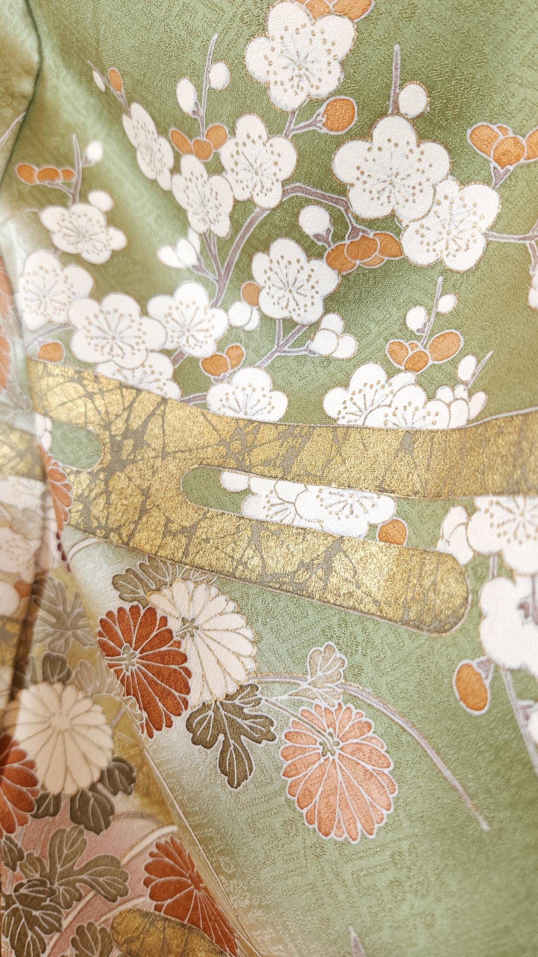 Golden green Iro Tomesode with countryside flowers