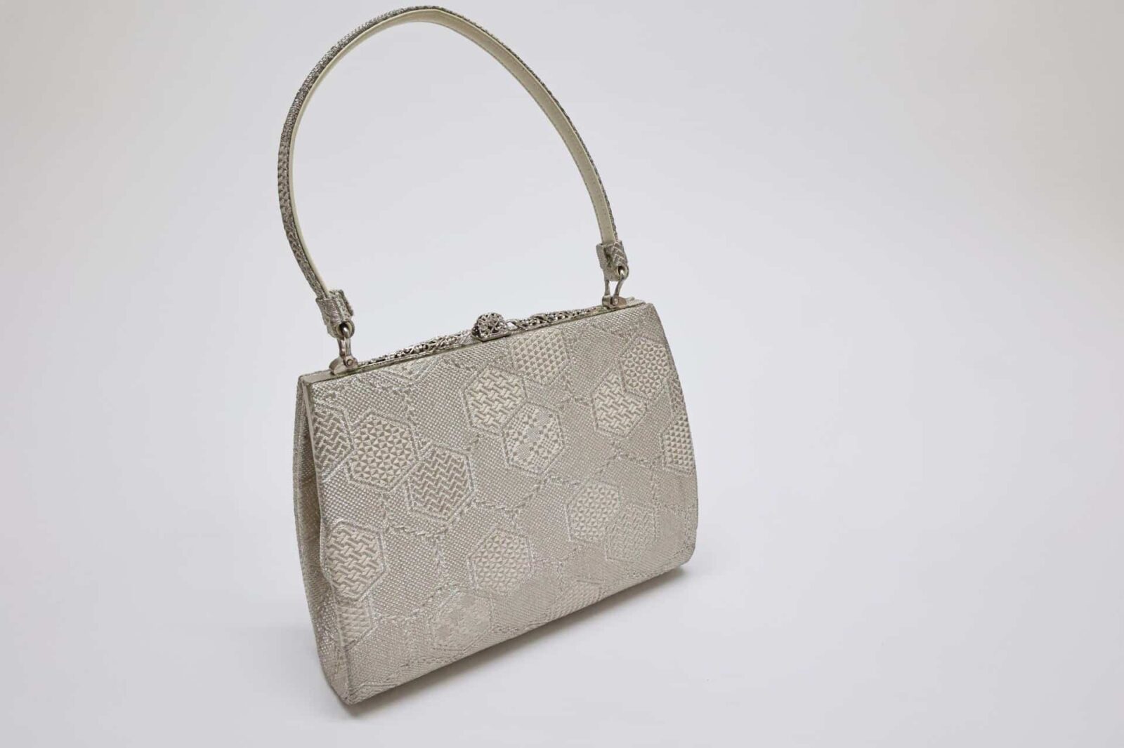Silver brocade kimono bag with Kikkō pattern