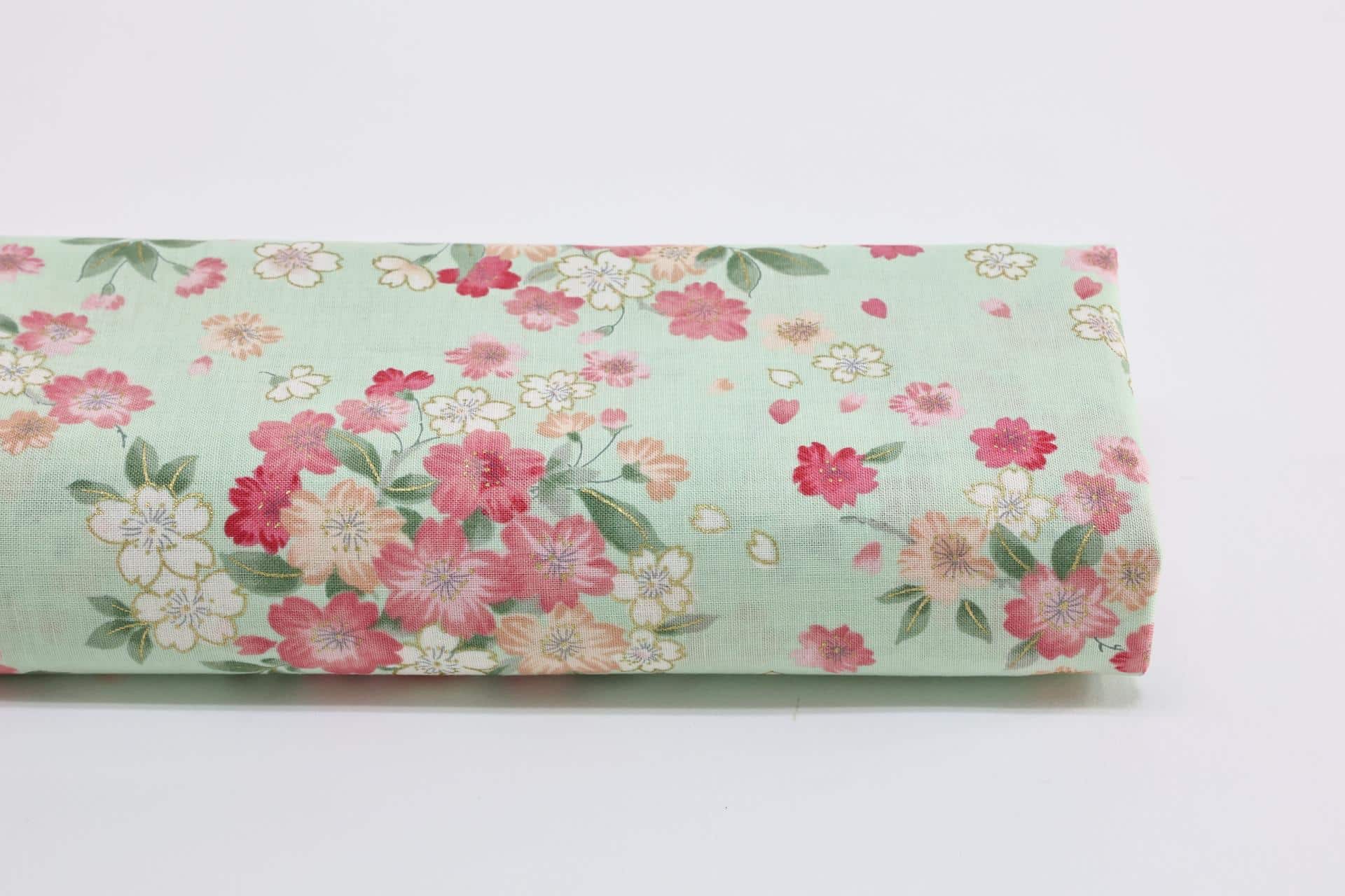 Japanese fabric cherry blossoms gold effect green background