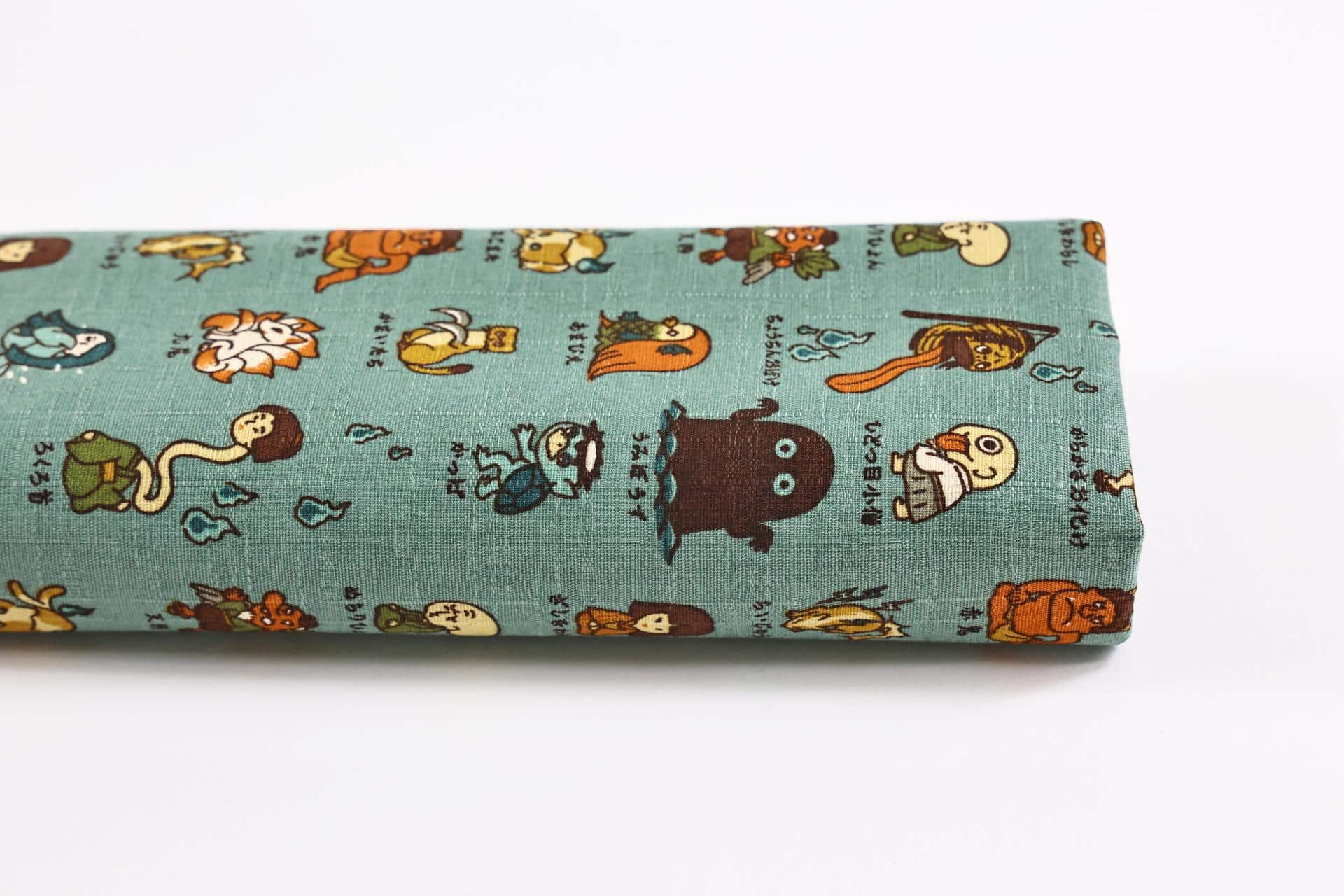 Japanese Yokai cotton dobby fabric green background