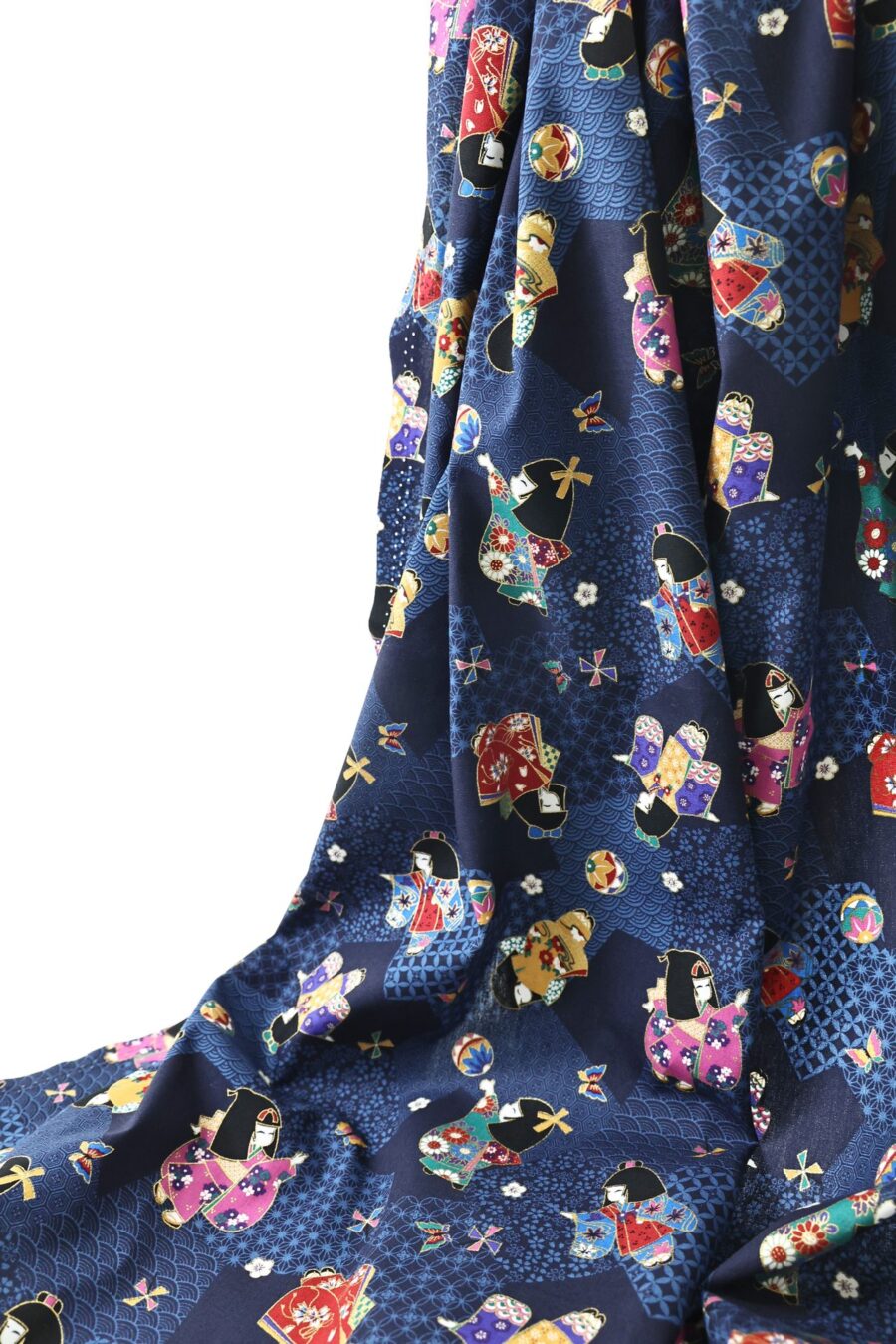 Tissu japonais enfants en kimono façon kokeshi sur fond bleu marine à motifs géométriques