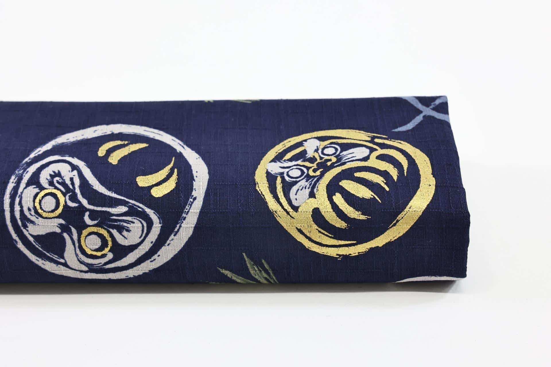 Japanese Daruma fabric on navy blue background